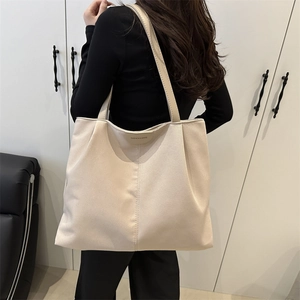 Minimalist beige oversized tote bag in faux leather for women's elegant daily commuting