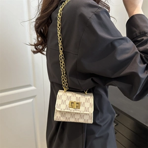 Fashionable beige mini crossbody bag with M-pattern texture and gold chain strap