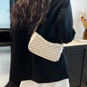 Chic beige crescent underarm bag featuring M-letter jacquard texture and gold chain strap