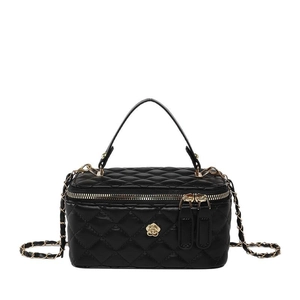 Black quilted crossbody bag with gold camellia logo and chain strap on white background