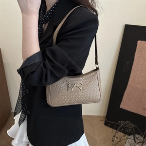 Chic light brown crescent underarm bag with woven leather pattern and golden bow buckle