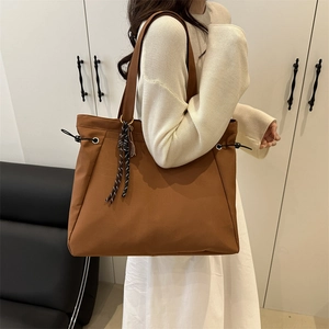 Brown large capacity nylon tote bag for women with side drawstrings and woven rope detail