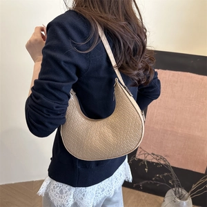 Chic solid color crescent underarm bag with woven texture for women's spring fashion