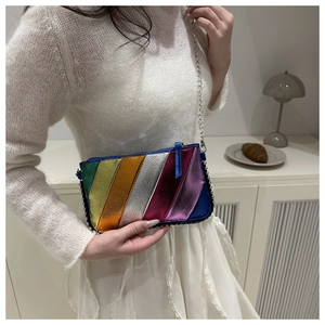 Detail of colorful rainbow metallic textured crossbody bag with silver chain strap