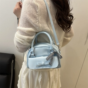 Chic light blue crossbody bag for women with leather bow and checkered ribbon strap