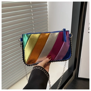 Detail of colorful metallic striped mini bag with silver studs and chain strap