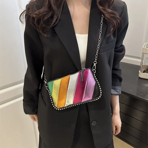 Fashionable rainbow striped crossbody bag with silver studs and metal chain strap