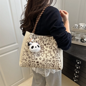 Beige woven backpack with bear print and panda charm shown on model in home setting