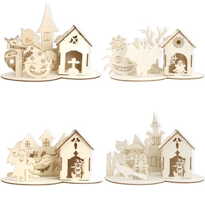 Detail of laser-cut wooden Halloween ornaments featuring ghosts and pumpkin patterns