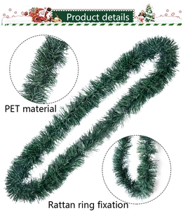 Detail of green artificial Christmas garland featuring PET pine needles and rattan ring fixation