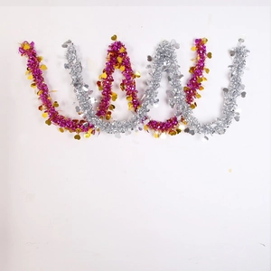 Close-up of festive PET tinsel garland with shiny heart sequins for holiday party decor