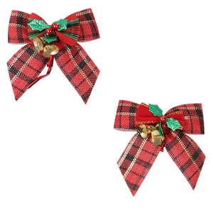 Detailed close-up of plaid Christmas bows with holly leaves, red berries and gold bells