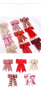 Close-up of assorted Christmas bows featuring plaid, stripes, and festive holiday patterns