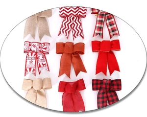 Close-up of assorted Christmas bows featuring burlap, velvet, and plaid patterns for trees