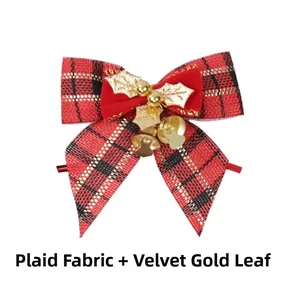 Detail of Christmas plaid bow with gold leaves and bells on faux linen fabric