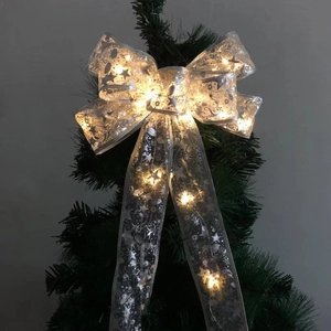 Leuchtende silberne Weihnachtsbaumsspitze Schleife mit warmen LEDs und Sternmustern