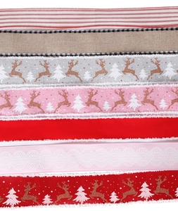 Detailed close-up of Christmas ribbon set with reindeer and snowflake prints