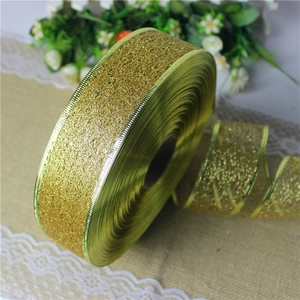 Detail of 2m gold glitter mesh ribbon with metallic wired edges for gift wrapping