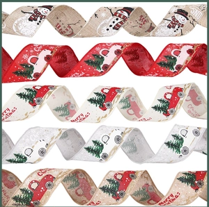 Close-up of assorted Christmas burlap ribbons with festive snowman and car patterns