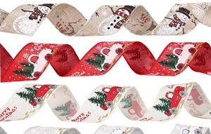 Detail of Christmas ribbons with snowman and red truck prints on rustic burlap fabric