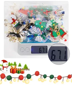 Detailed view of 67.1g Christmas hair clip set with snowman and tree motifs