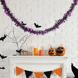 Halloween garland detail with purple and black tinsel on a festive fireplace mantel