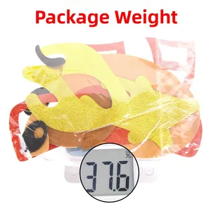 Close-up of glittery Christmas reindeer antlers and masks in a bag weighing 37.6g
