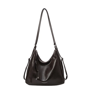 Retro dark brown large capacity faux leather tote bag with tassel detail for commuting