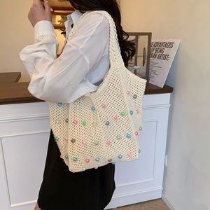 Handmade cream crochet tote bag with colorful 3D pearls and spacious woven knit design