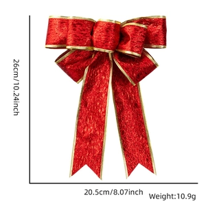 Detail view of a 26cm red velvet Christmas bow with gold trim and exact dimensions