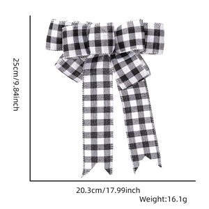 Detail view of black and white buffalo plaid Christmas bow with size 25x20.3cm