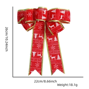 Detail showing 26x22cm red burlap Christmas bow with reindeer patterns and gold trim