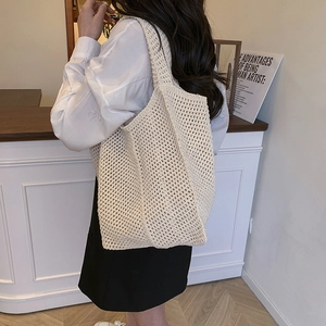 Chic beige crochet tote bag with hollow knit mesh design for women's spring fashion