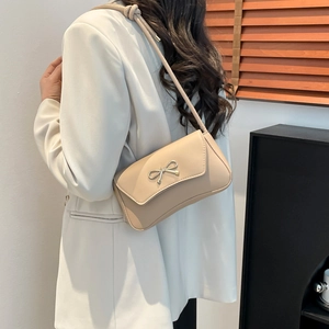 Minimalist apricot square underarm bag for women with silver bow accessory in casual style