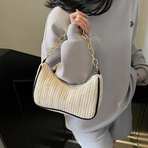 Chic woven underarm bag in cream beige with a chunky gold chain strap for women