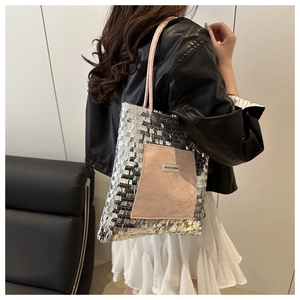 Detail of silver sequin tote bag with pink pocket and AGOGO ORIGINAL brand tag