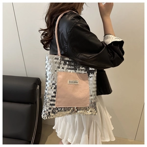 Detail of silver sequin tote bag with pink Agogo Original pocket and shoulder strap