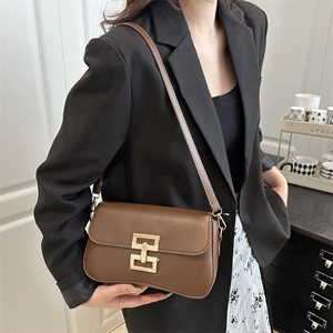 Brown leather crossbody bag with golden H buckle and adjustable strap for women