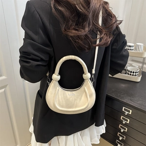 Chic beige crescent shoulder bag in matte texture with Fashion lettering and slim strap