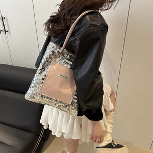 Silver sequin tote bag with a pink fabric outer pocket and stylish thin pink handles