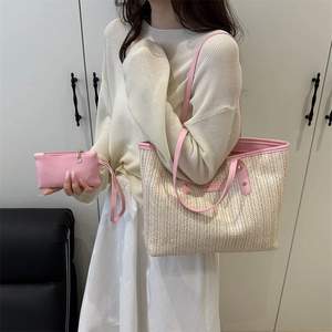 Straw woven tote bag with pink leather handles and matching clutch for summer