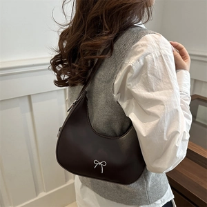 Fashionable dark coffee crescent hobo shoulder bag with a silver bow tie accent for women