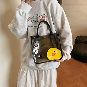 Sac fourre-tout en PVC noir translucide avec canard jaune et poignées en ruban