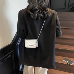 Chic silver crocodile-textured crossbody bag with fine chain strap and metal clasp