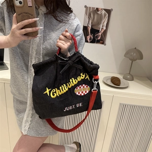 Chillvibes black denim drawstring tote bag with red handles and embroidery