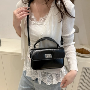 Chic black glossy square shoulder bag with silver rotating lock for elegant women style