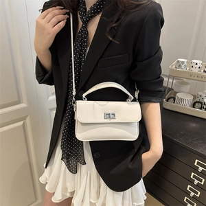 Minimalist beige leather square handbag with silver clasp and shoulder strap for women
