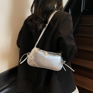 Silver metallic baguette shoulder bag with side bow knots and rivet details for women