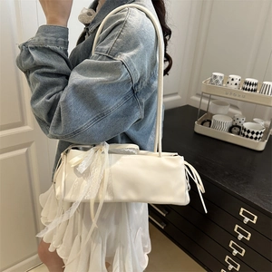 Chic white baguette bag with lace ribbon detailing for women spring 2025 fashion