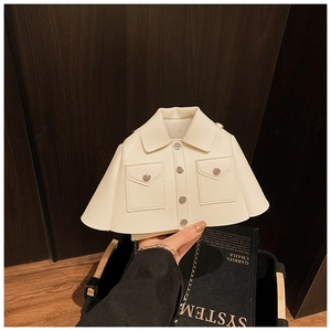 Detail of creative mini jacket-style crossbody bag in beige faux leather with chain strap
